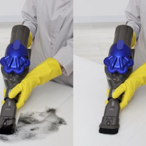 Woman in gloves disinfecting mattress with vacuum cleaner indoors, closeup. Space for text